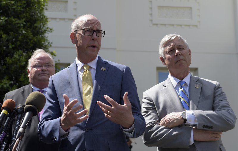 Rep. Greg Walden, R-Ore., center, flanked by Rep. Billy Long, R-Mo., left, and Rep. Fred Upton, R-Mich., speaks to reporters outside the White House in Washington on Wednesday, May 3, 2017, after a meeting with President Donald Trump on health care. 