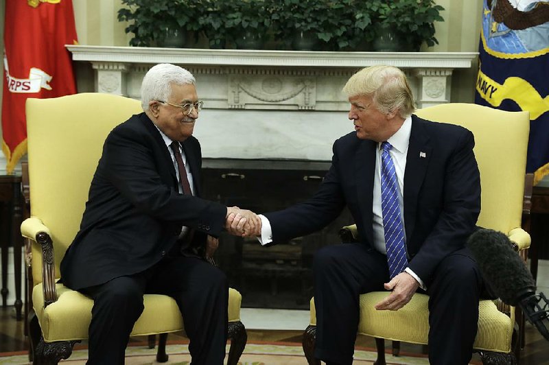 Palestinian leader Mahmoud Abbas and President Donald Trump meet Wednesday at the White House, where Trump committed to helping the Israelis and Palestinians reach a peace agreement.