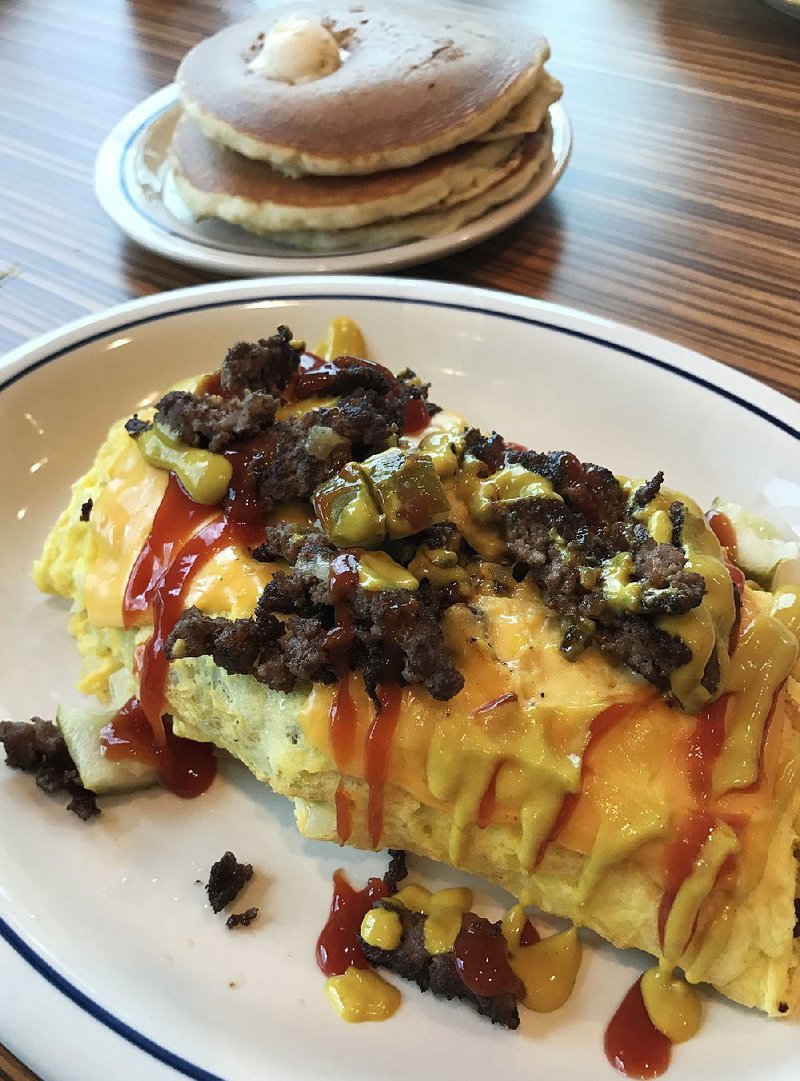 The Cheeseburger Omelette, served with pancakes, is an over-the-top selection at IHOP.