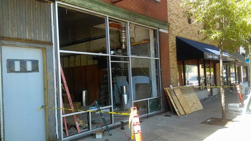 Restoration works continues Tuesday, May 2, 2017, after a fire damaged Midtown Billiards in Little Rock's South Main District last year.