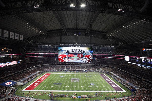 The large video screen shows the Arkansas and Texas A&M logos before an NCAA college football game at AT&T Stadium on Saturday, Sept. 24, 2016, in Arlington, Texas. (AP Photo/Roger Steinman)

