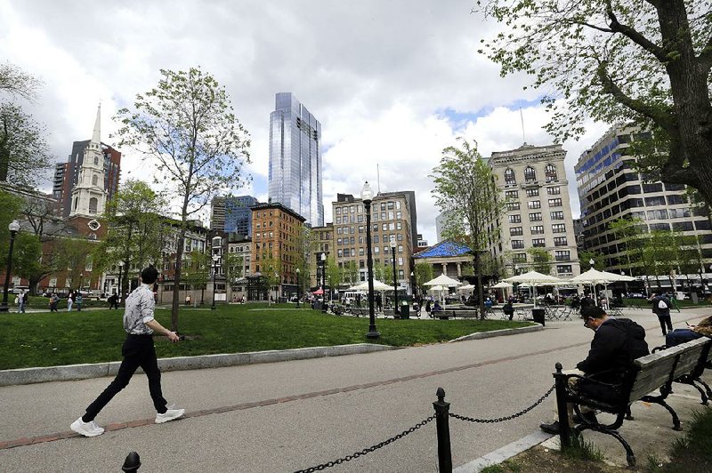 Visitors stroll and pause Wednesday in Boston Common, the nation’s oldest city park. Developers’ plans for a skyscraper nearby have raised complaints that it would violate the state’s shadow law.