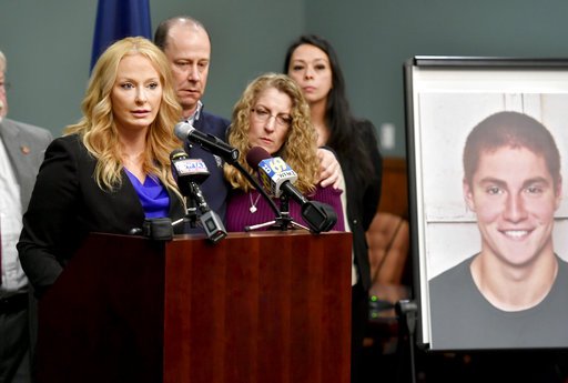 Jim and Evelyn Piazza stand by as Centre County District Attorney Stacy Parks Miller, left, announces the results of an investigation into the death of their son Timothy Piazza, seen in photo at right, a Penn State University fraternity pledge, during a press conference Friday, May 5, 2017, in Bellefonte, Pa. 