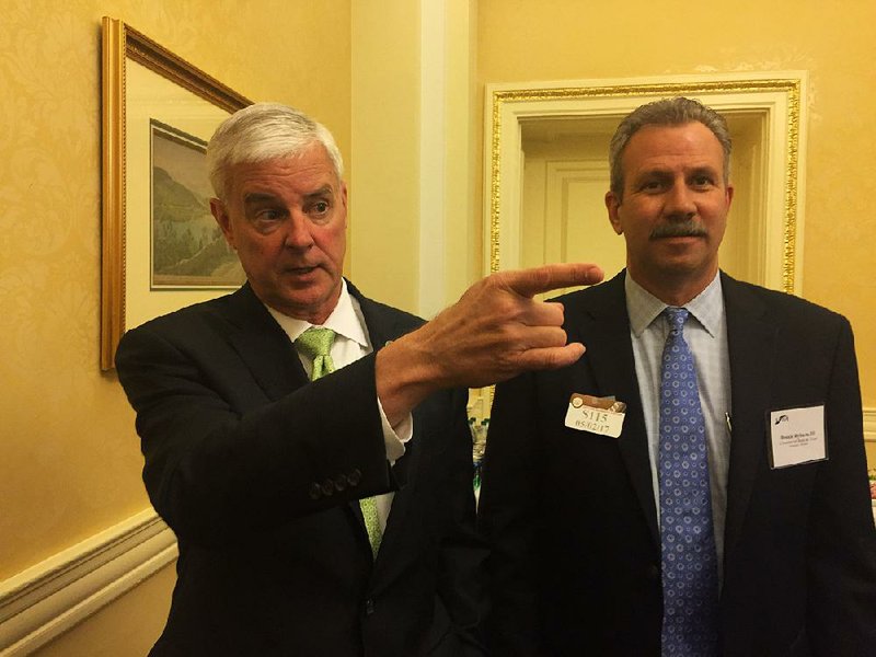 Rep. Steve Womack (left) met with Bennie Ryburn III of Commercial Bank and Trust and several other Arkansas bankers this week at the U.S. Capitol. The visitors urged Congress to roll back some of the rules put in place after the 2008 financial crisis. 