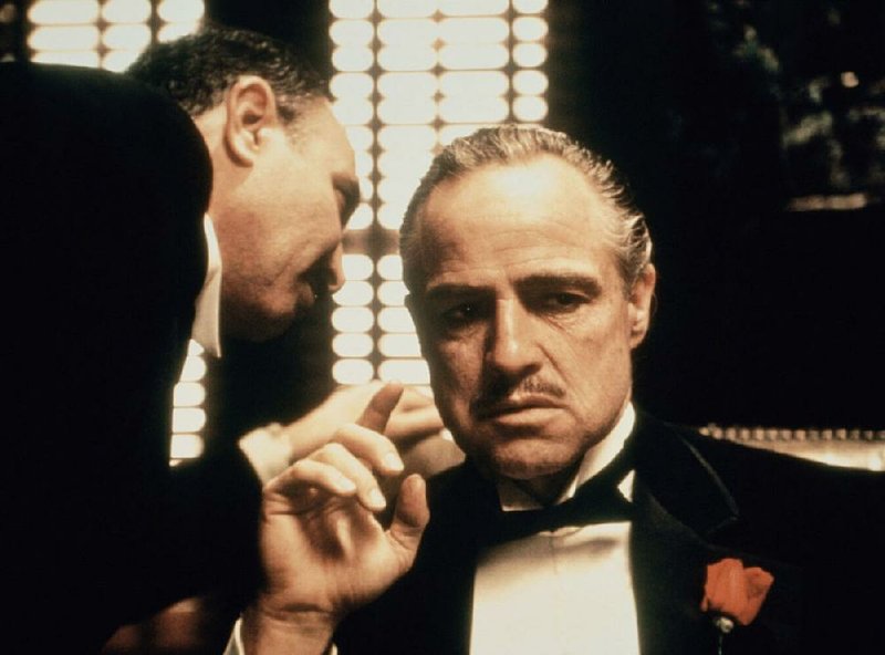 Amerigo Bonasera (Salvatore Corsitto) asks Don Vito Corleone (Marlon Brando) for a favor in The Godfather.