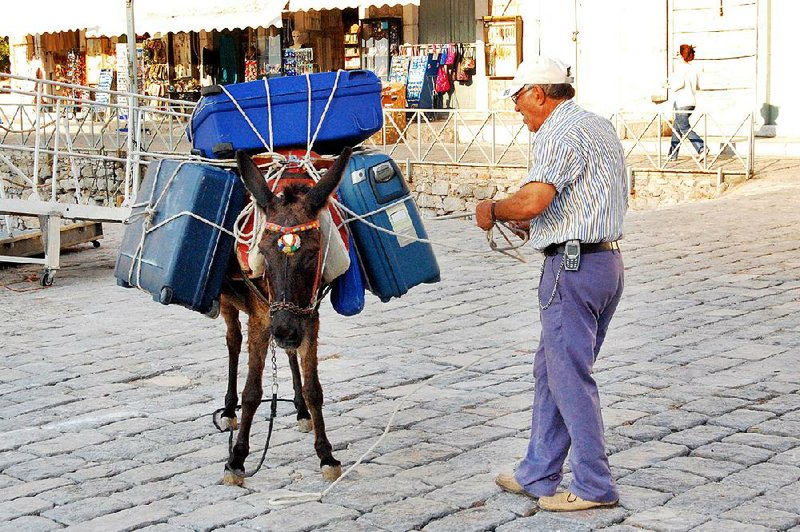 Since there are no cars on the Greek island of Hydra, you need to pack light or hire a donkey.
