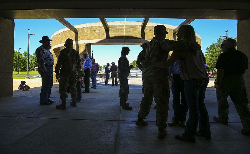 Current and former members of the Arkansas National Guard’s 39th Infantry Brigade Combat Team gather during a 50th anniversary celebration Saturday afternoon at Camp Robinson in North Little Rock. 
