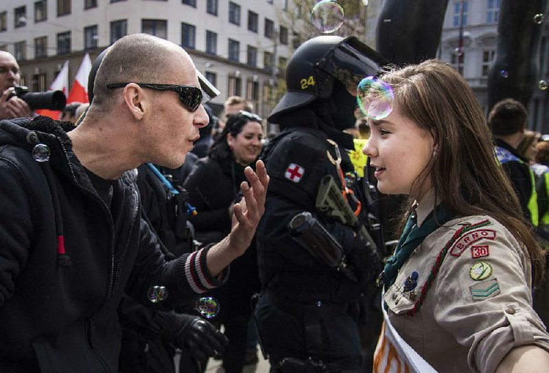 Lucie Myslikova, 16, stands up to a far-right marcher during Monday’s rally in Brno, Czech Republic. 
