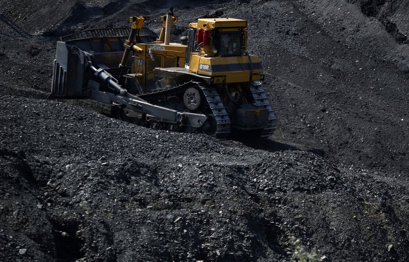 A bulldozer moves coal at an Alpha Natural Resources Inc. coal preparation plant in Logan County near Yolyn, West Virginia, on Aug. 5, 2015. 