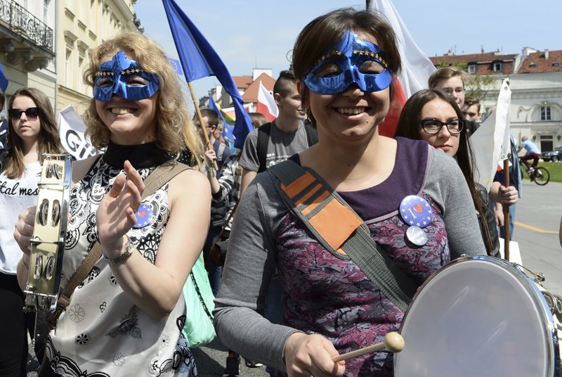 Young people march during the yearly Schumann Parade supporting European Union ideas, in Warsaw, Poland, Saturday, May 6, 2017. 