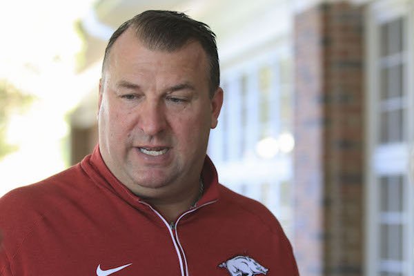 Arkansas football coach Bret Bielema talks with the media Monday night before an event at the Pine Bluff country club.