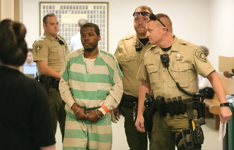 Antoine Jackson is escorted Monday from Circuit Judge Mark Lindsay&#8217;s courtroom at the Washington County Courthouse in Fayetteville. Jackson plead guilty to to first degree murder for the shooting death of Emily Nash, who was found dead in her Springdale apartment May 27, 2015.