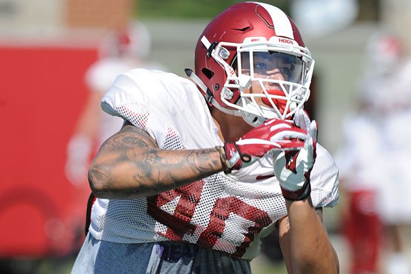 Arkansas linebacker Kyrei Fisher takes part in a drill Saturday, April 1, 2017, during practice at the university practice field in Fayetteville. 
