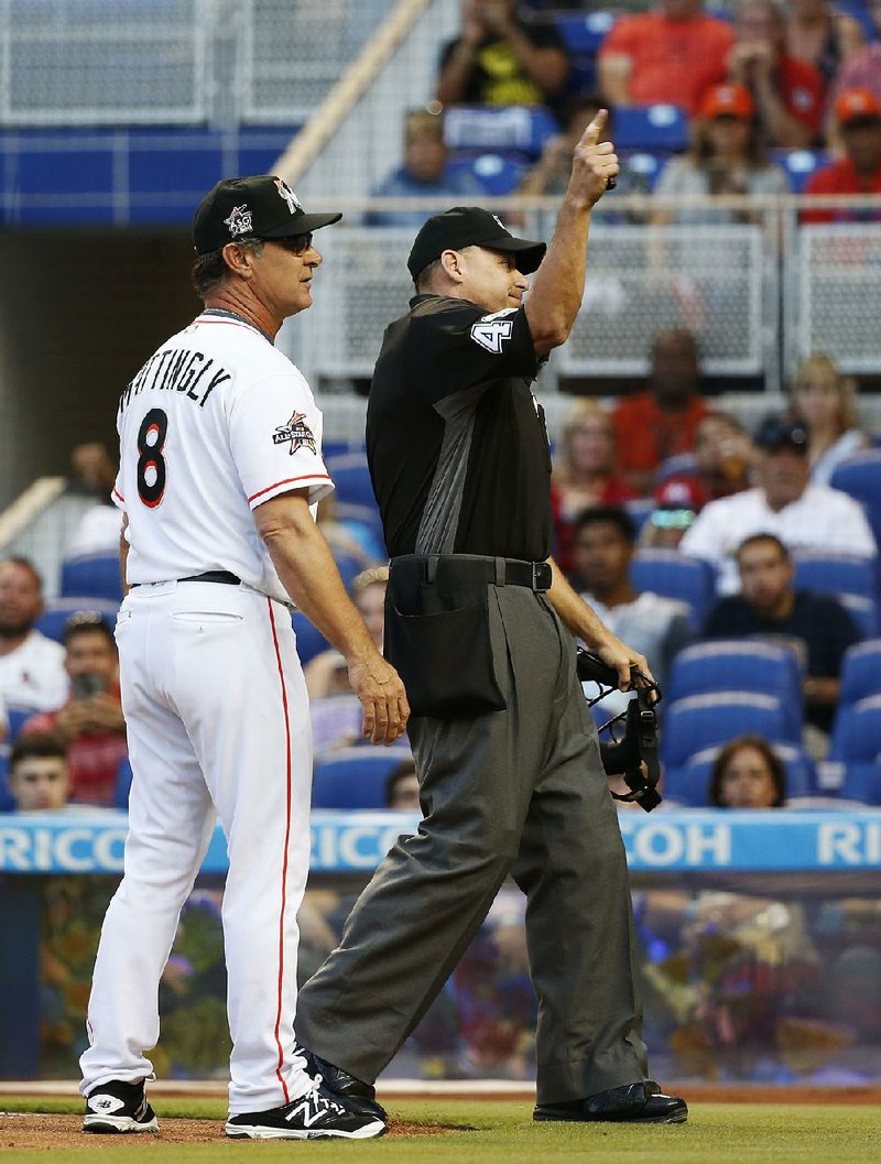 Miami Marlins Manager Don Mattingly is ejected by home plate umpire Andy Fletcher during the first inning of Tuesday night’s game against the St. Louis Cardinals.