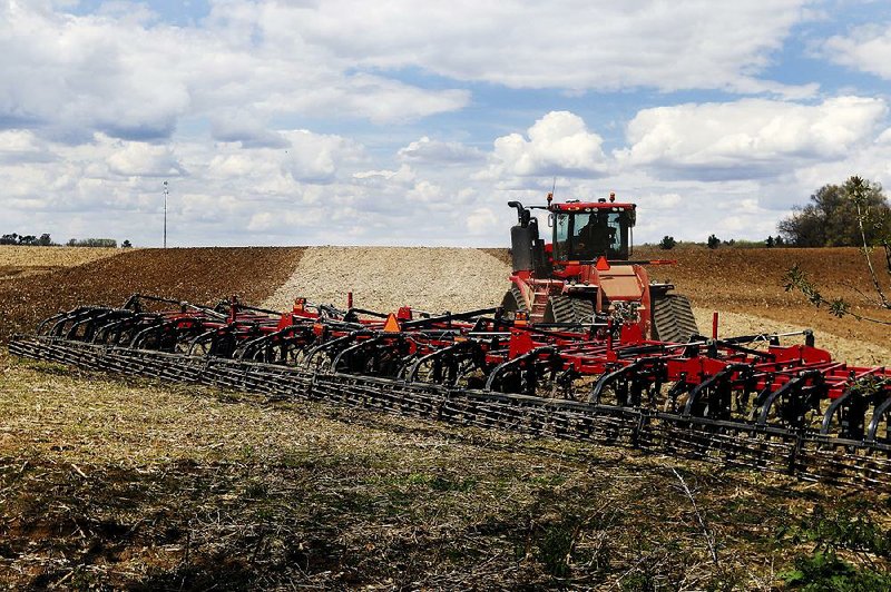 A farmer works a field on May 3 south of Eau Claire, Wis. A recent cold spell and rain has slowed crop planting in Wisconsin, now about a week behind the five-year average. 