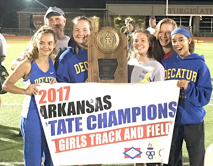 Submitted Photo The Decatur girls&#8217; track team proudly displays the championship trophy won during the 2017 Arkansas 1A State Track Meet at Hendrix College in Conway on May 2. The Lady Bulldogs won the title with only five girls. This year&#8217;s team included Destiny Meija (left), Coach Shane Holland, Cameron Shaffer, Meagan Smith, Paige Vann and Desi Meek.