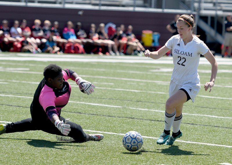 Bud Sullins/Special to the Herald-Leader Siloam Springs junior forward Audrey Maxwell dribbles around Russellville&#8217;s goalkeeper during Saturday&#8217;s 6A-West Conference Tournament finals. Maxwell leads the Lady Panthers with a single-season school record of 38 goals on the year.