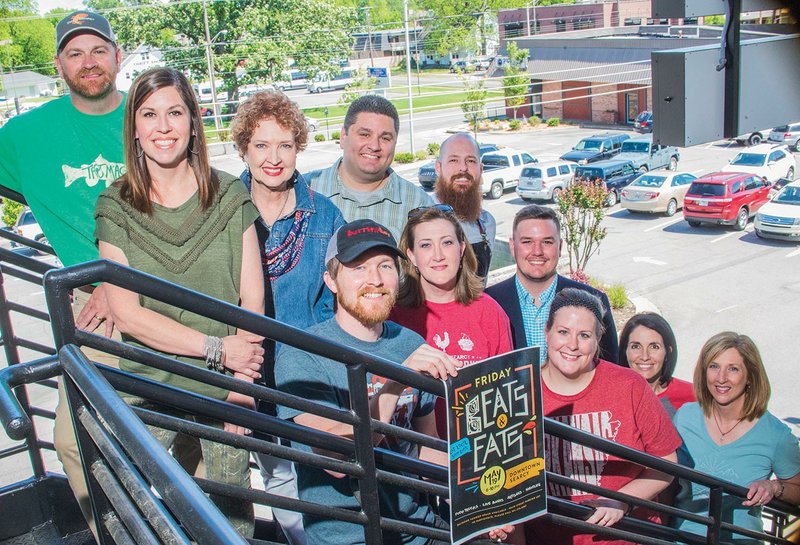 Members of the group coordinating Beats & Eats in Searcy are Jeff Smith, from left, top, Heather Kemper and Marka Bennett, and continuing on the back row, Matt Faulkner and Ben Dubose; and front, Brandon Fox (holding the sign), Amy Burton, Tim Reilly, Kari Fox, Barbara Milton and Angela Sivia. The event will take place from 6-10 p.m. May 19 in downtown Searcy and feature artwork, vendors, food trucks, live music and more.