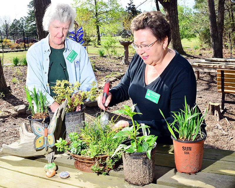Eleanor Hilsenrath, left, and Cynthia Lacken prepare plants for the Van Buren County Master Gardeners 