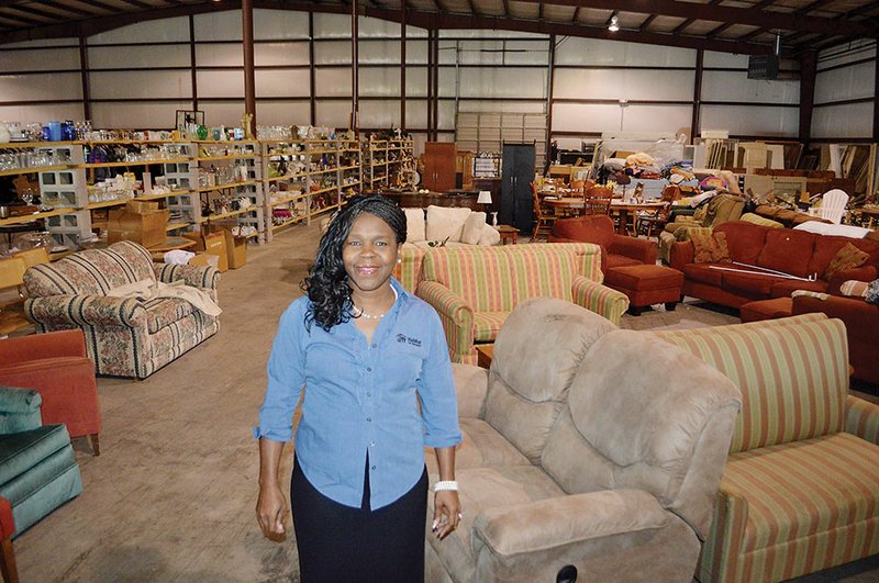 Shenel Sandidge, executive director of Habitat for Humanity of Faulkner County, stands inside the Habitat HomeStore, 1350 EW Martin Drive in Conway, which will open June 1. Sandidge said donated items, new and used, will be sold to the public to help fund the nonprofit organization’s projects.