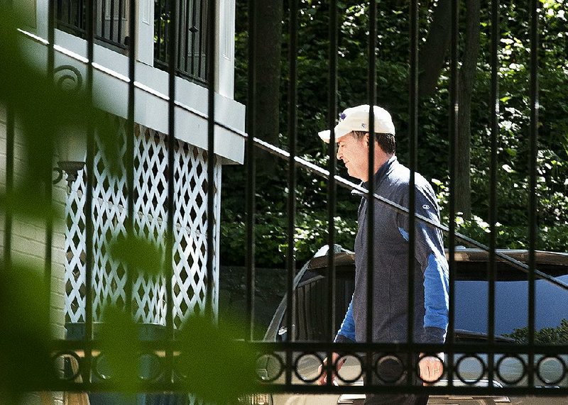 Former FBI Director James Comey arrives at his home Wednesday in McLean, Va., a day after he was fired by President Donald Trump. Democrats and Republicans “will be thanking me,” Trump said on Twitter.
