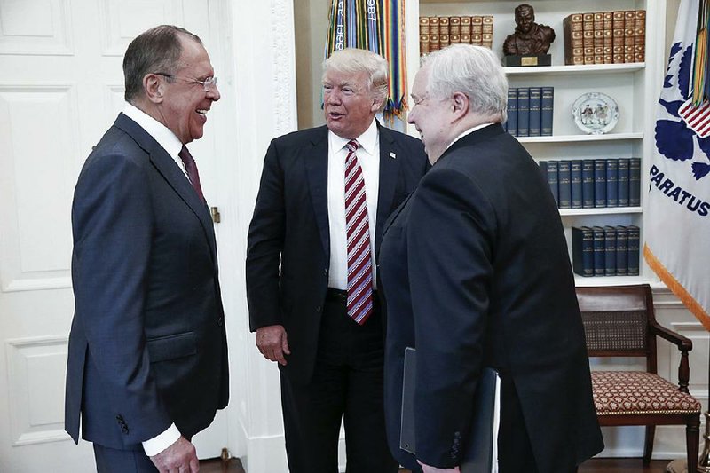 President Donald Trump greets Russian Foreign Minister Sergey Lavrov (left) and Sergei Kislyak, Russia’s ambassador to the United States, before a private meeting Wednesday at the White House.