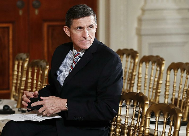  In this Feb. 10, 2017 file photo, then-National Security Adviser Michael Flynn sits in the East Room of the White House in Washington. Documents released by lawmakers show Flynn, now former national security adviser, was warned when he retired from the military in 2014 not to take foreign money without "advance approval" by Pentagon authorities. 