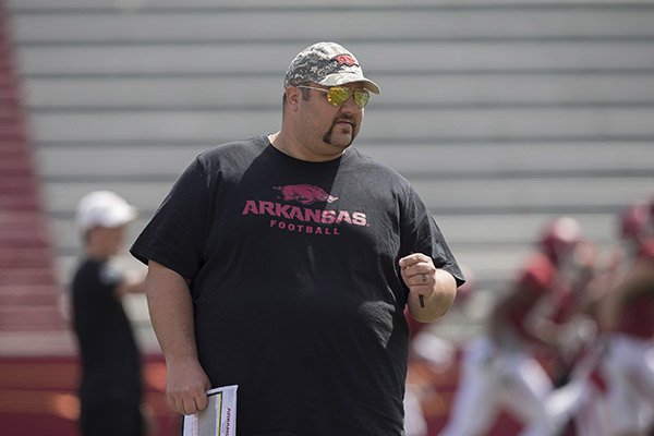 Arkansas offensive line coach Kurt Anderson watches warmups during practice Saturday, April 8, 2017, in Fayetteville. 