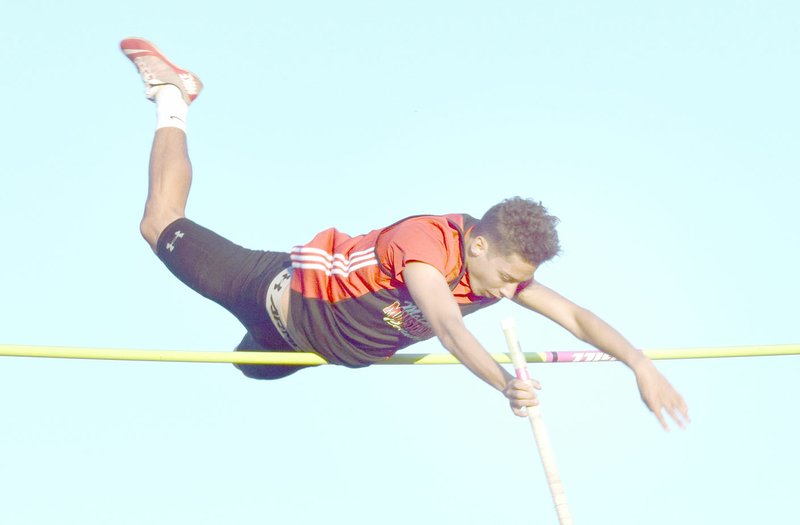 Photo by Rick Peck McDonald County pole vaulter Zack Woods clears 12-3 to win a Big 8 Conference championship at the conference track meet held May 4 at Cassville High School.