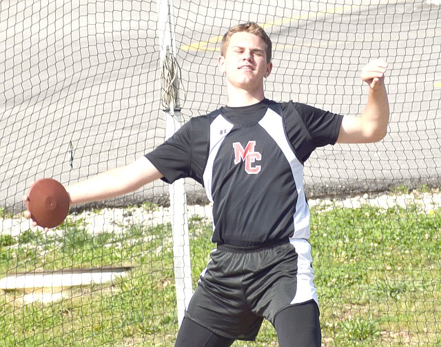 Photo by Rick Peck McDonald County seventh-grader Garrett Gricks lets loose the discus on his way to taking second in the event with a throw of 97-10. Gricks added a first place in the shot put (40-0) and a sixth in the 200 (28.2) to lead his team to a third place finish in the Big 8 Conference Junior High Track and Field Championships held May 2 at MCHS.