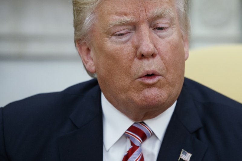 President Donald Trump talks to reporters during a meeting with Dr. Henry Kissinger, former Secretary of State and National Security Advisor under President Richard Nixon, in the Oval Office of the White House, Wednesday, May 10, 2017, in Washington. (AP Photo/Evan Vucci)