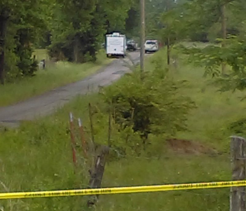 Authorities respond Thursday, May 11, 2017, to a reported hostage situation at Alpha and Gum Springs roads just outside Chickalah in Yell County. The suspect, linked to three killings earlier in the day, has threatened to shoot at law enforcement if they approach a residence where he is believed to be holding two people inside, according to an Arkansas Democrat-Gazette reporter at the scene.