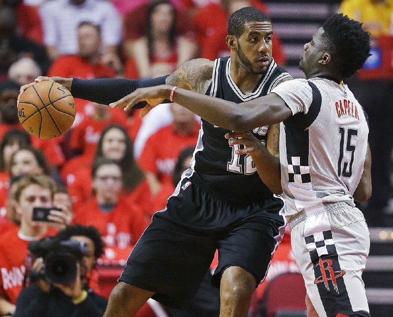 San Antonio’s LaMarcus Aldridge took it to Houston’s Cliff Capela early and never let up during the Spurs’ series-clinching 114-75 victory over the Houston Rockets Thursday in Houston. Aldridge was 16 of 26 from the floor and grabbed 12 rebounds as the Spurs eliminated the Rockets 4-2 in the best-of-7 Western Conference
semifinal. San Antonio moves on to meet Golden State in the Western Conference fi nal.