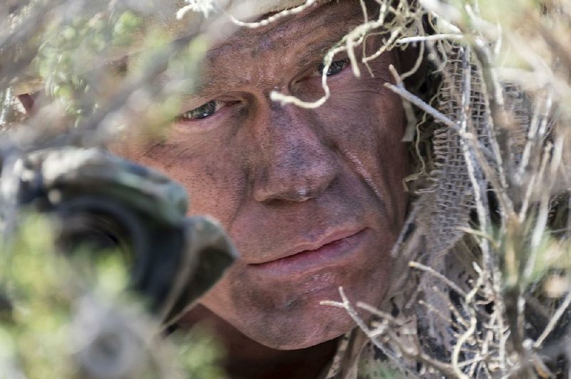 Wrestler John Cena takes on a straight dramatic role as a U.S. Army Ranger sniper in the tense military action movie The Wall.
