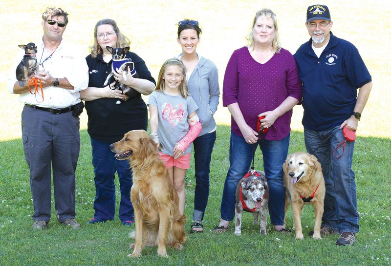 From left, Sidney and Debbie Gray, Stephanie Dewey and her daughter Natalie, and Carole and Bill Ridgeway all look forward to the new Cabot Dog Park, scheduled to open early this summer.