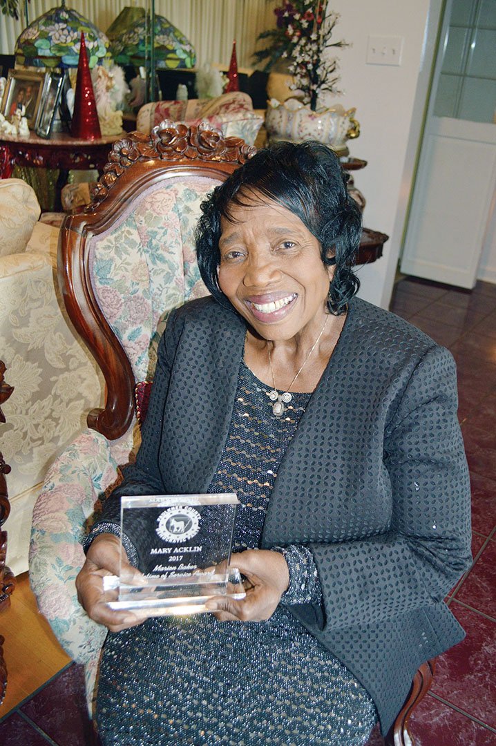 Mary Acklin of Conway holds the Marion Baker Lifetime of Service Award she received Tuesday from the Faulkner County Democratic Party. Acklin has been a member of the group for decades. Retired from the Conway Human Development Center, she manages Acklin Rental Property and is active in her church and other civic groups.