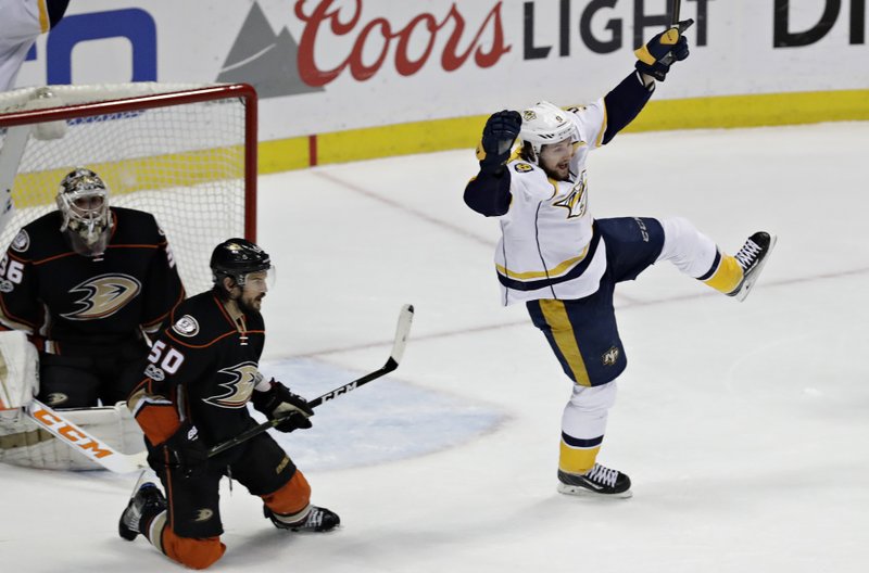 Nashville Predators' Filip Forsberg, right, celebrates after scoring against Anaheim Ducks' Antoine Vermette, center, and goalie John Gibson during the first period of Game 1 in the NHL hockey Stanley Cup Western Conference finals, Friday, May 12, 2017, in Anaheim, Calif. (AP Photo/Chris Carlson)