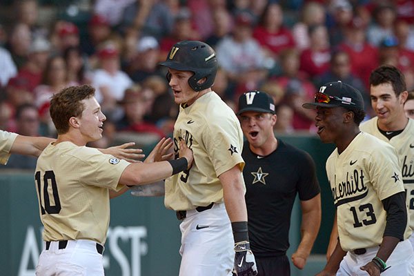 Ethan Paul (10), Vanderbilt second baseman, congratulates Will Toffey (9), Vanderbilt third baseman, after Toffey hit a home run Saturday, May 13, 2017, during the fifth inning against Arkansas at Baum Stadium in Fayetteville.
