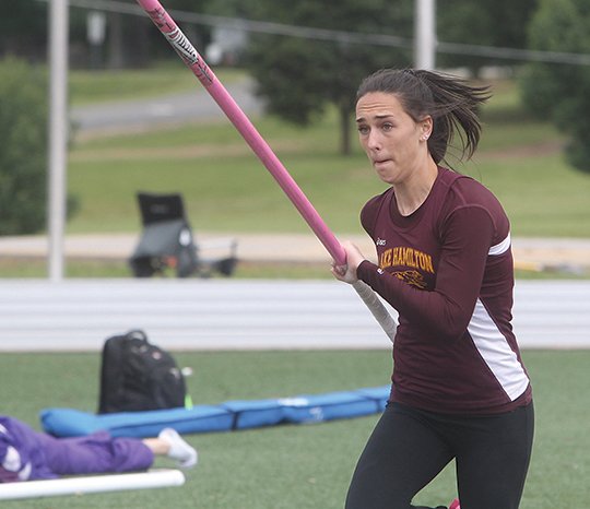 The Sentinel-Record/Richard Rasmussen BAR EXAM: Lake Hamilton sophomore Edie Murray clears 12 feet, 8 inches to edge senior teammate and defending champion Madison Shinn (12-4) in the girls' pole vault at the Class 6A meet May 4 at Wolf Stadium. Murray and Shinn are among four Lady Wolf vaulters in the Meet of Champions today at Russellville High School.