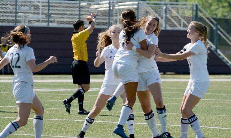 Siloam Springs players, from left, Audrey Maxwell, Sydney Bomstad, Laura Morales, Brooklyn Buckminster and Abigail Cole celebrate after Buckminster scored in the first half to give Siloam Springs a 1-0 lead over Benton in the Class 6A state semifinals. Siloam Springs defeated Benton to reach the state title game. 