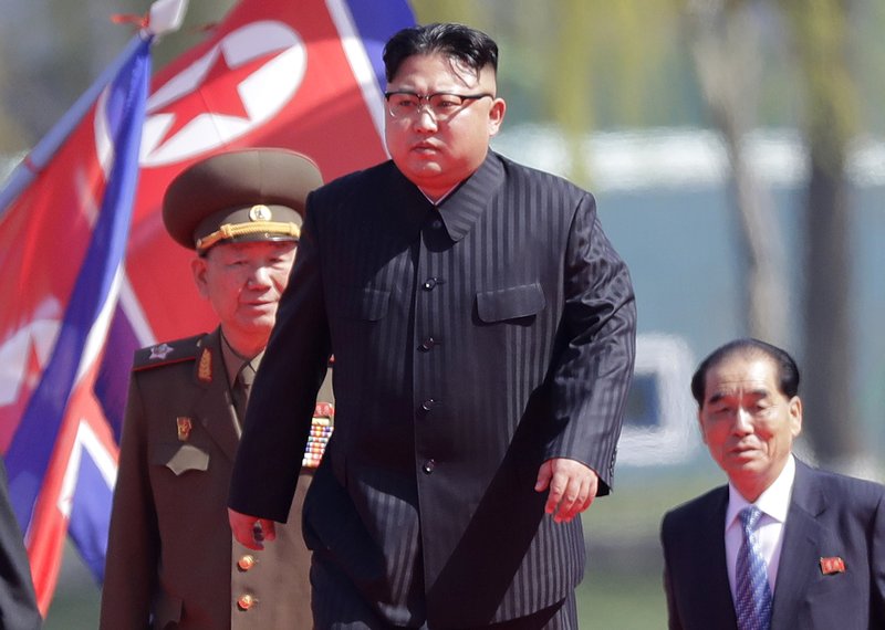 In this April 13, 2017 file photo, North Korean leader Kim Jong Un, center, is accompanied by Pak Pong Ju, right, Hwang Pyong So, second left, as he arrives for the official opening of the Ryomyong residential area, in Pyongyang, North Korea. 