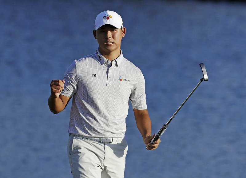 Si Woo Kim, of South Korea, became the youngest player to capture The Players Championship on Sunday after the 21-year-old shot a final-round 3-under 69 to hold off a late charge from Ian Poulter at TPC Sawgrass in Ponte Vedra Beach, Fla.