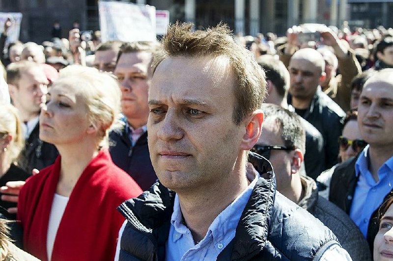 Russian opposition leader Alexei Navalny (center) takes part in a rally in Moscow on Sunday.