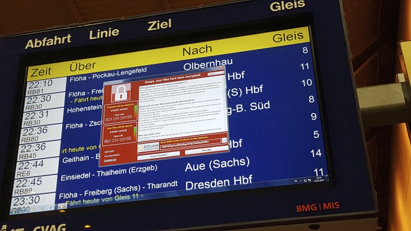 In this May 12, 2017 photo, a display panel with an error can be seen at the main railway station in Chemnitz, Germany. Germany&#x2019;s national railway says that it was among the organizations affected by the global cyberattack but there was no impact on train services. Deutsche Bahn said early Saturday that departure and arrival display screens at its stations were hit Friday night by the attack. (P. Goezelt/dpa via AP)