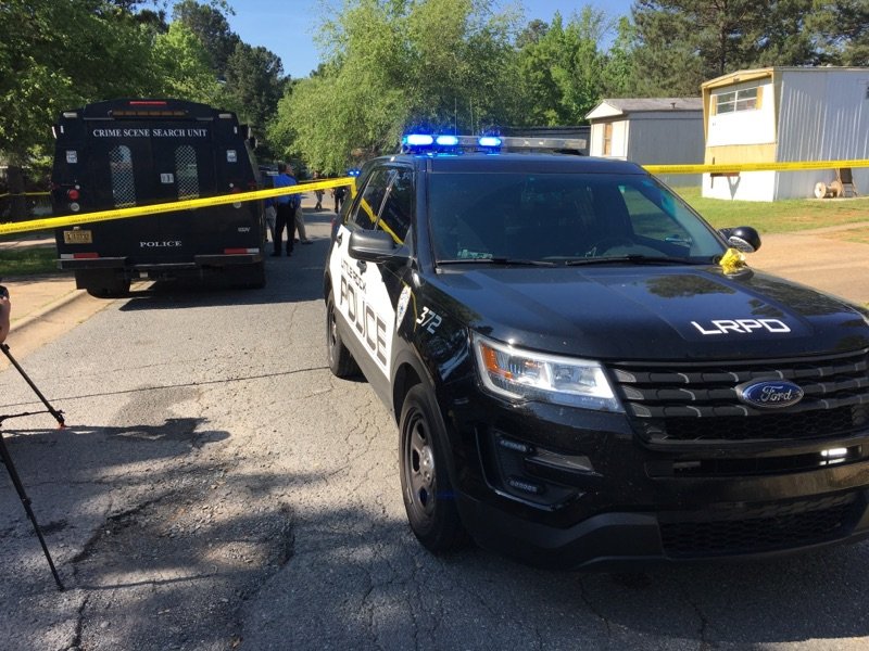 Police investigate a double homicide Monday morning in a mobile home community on Chicot Road in Little Rock.