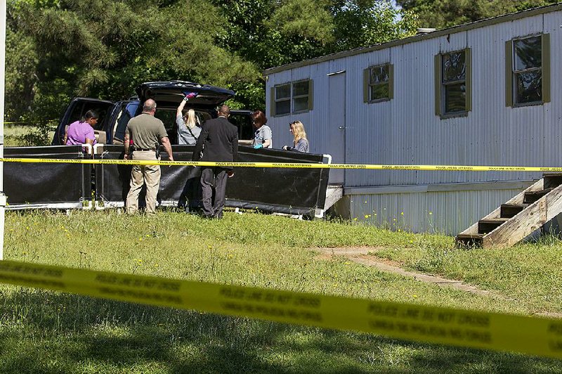 Little Rock police investigate a double homicide Monday morning after two women were found dead inside a vehicle parked next to a vacant mobile home at 11500 Chicot Road.