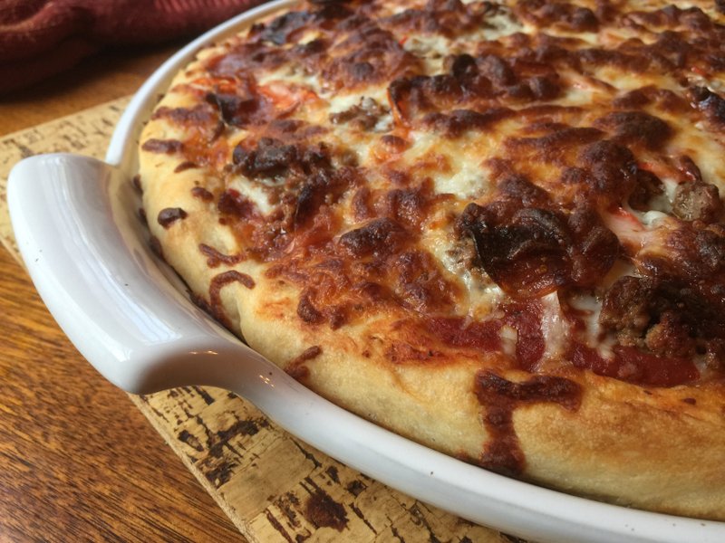 Four-hour pizza crust topped with peppers, onions, hamburger, pepperoni and lots of mozzarella cheese 