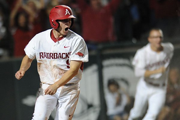 Arkansas shortstop Jax Biggers reacts after scoring the game-winning run against Vanderbilt during the ninth inning Friday, May 12, 2017, in Fayetteville. 