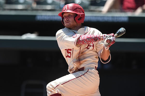 Arkansas outfielder Jake Arledge records a single during the first inning of a game against Vanderbilt on Sunday, May 14, 2017, in Fayetteville. 