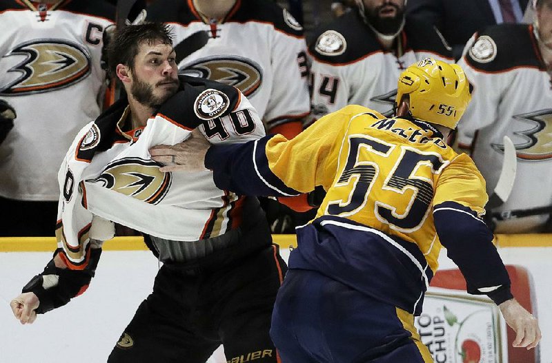 Anaheim right wing Jared Boll (left) and Nashville left wing Cody McLeod fight during the second period in Game 3 of the NHL Western Conference flnals Tuesday night. The Predators scored two goals in the third period to beat the Ducks 2-1. 